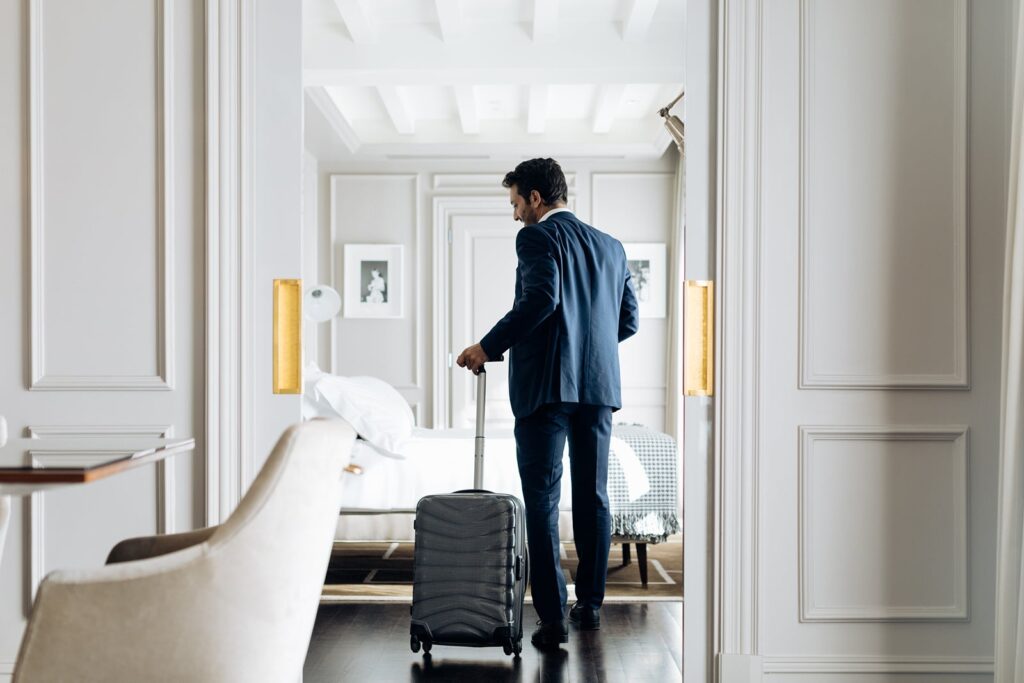 Man checking into a hotel room